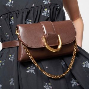 Great condition! Can be worn as a belt bag, crossbody, or clutch.